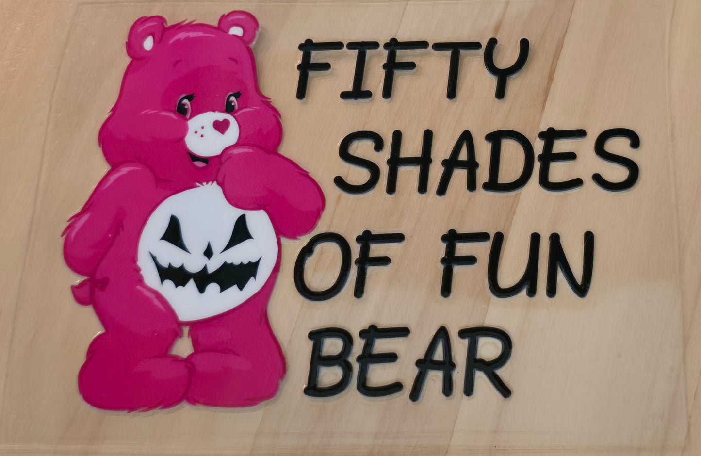 Hot pink care bear with the words Fifty Shades of Fun Bear