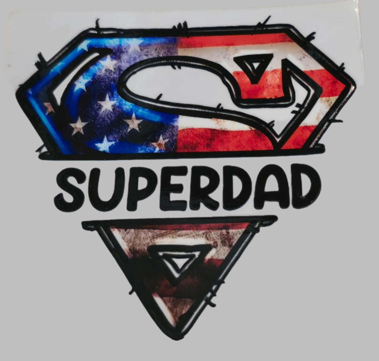 Sticker with 'SUPERDAD' design on a white background